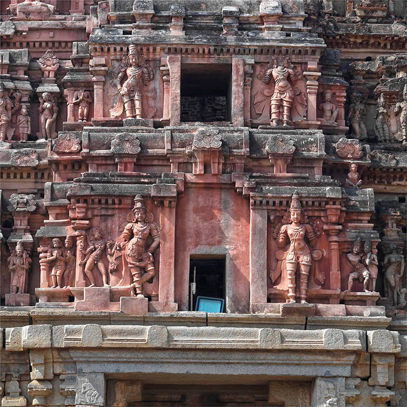 Nestled amidst the captivating ruins of Hampi, the Vijaya Vitthala Temple stands as a testament to India's rich cultural and artistic heritage. At the heart of this architectural masterpiece lies the awe-inspiring Gopuram, a towering structure adorned with an array of exquisitely carved deities, transporting visitors back in time to the 13th century. This UNESCO World Heritage Site in Karnataka, India, is a veritable treasure trove of art and culture.