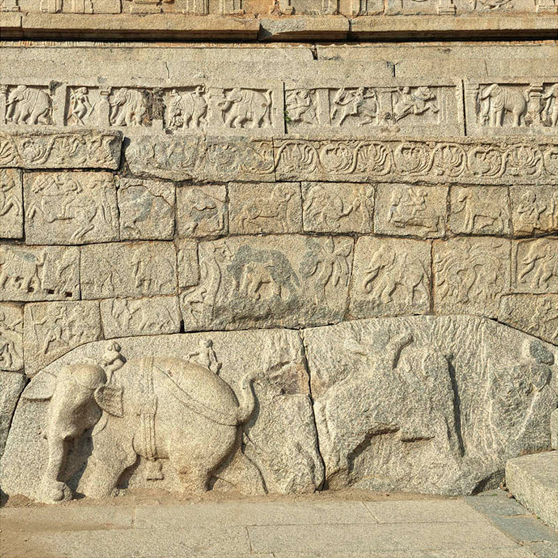 Hampi - Stories carved in stone near Mahanavmi Dibba. A Unesco World Heritage Site (with Frame)